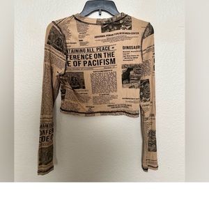 Dressed in LaLa Ribbed Cropped Long Sleeve News Paper Top